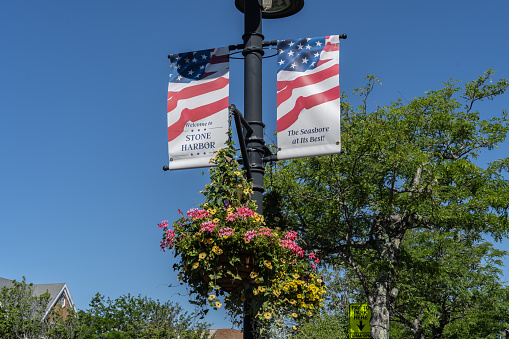 Stone Harbor, New Jersey-June 18, 2022: Welcome to Stone Harbor Banner on 96th Street in Stone Harbor, New Jersey which is the main shopping district of this quaint upscale beach town