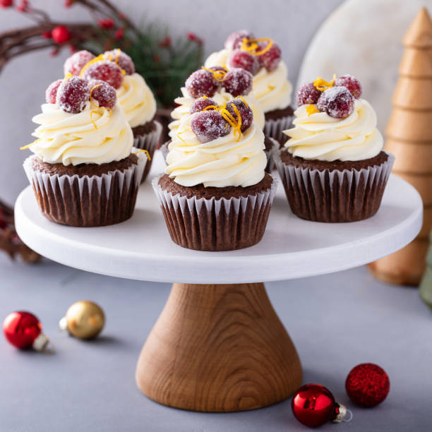 istock Sugared cranberry and orange chocolate cupcakes with cream cheese frosting 1456907354