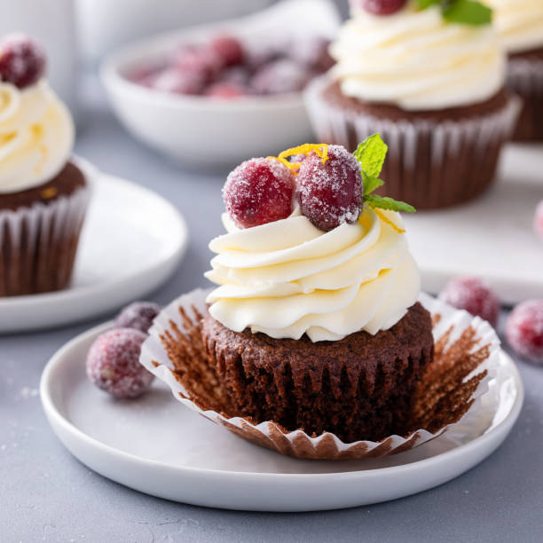 istock Sugared cranberry and orange chocolate cupcakes with cream cheese frosting 1456907364