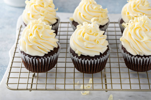 istock White and dark chocolate cupcakes with chocolate curls 1456907431