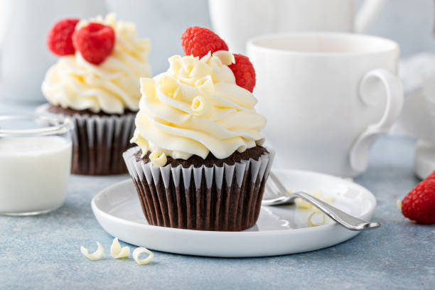 istock White and dark chocolate cupcakes with chocolate curls 1456907440