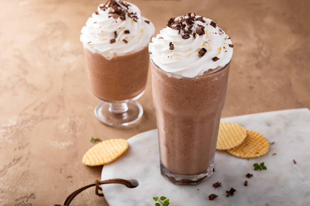 istock Coffee frappe topped with whipped cream and chocolate curls 1456907505
