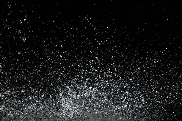 istock Blur Defocus Image of Water hit wall ground, explode into drop droplet. Amount Water attack impact and fluttering in air explosion. Stop motion freeze shot. Splash Water for texture elements 1456910309