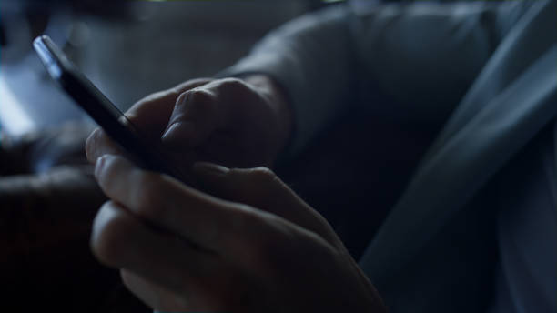 istock Businessman hands holding smartphone closeup. Unknown man worker texting partner 1456912727