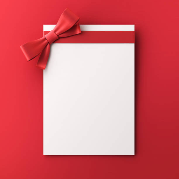 istock Gift Cards With Red Colored Bow on red background stock photo 1456914324