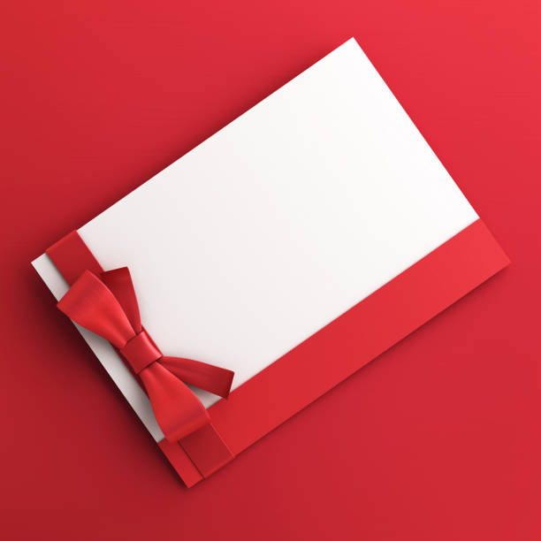 istock Gift Cards With Red Colored Bow on red background stock photo 1456914500