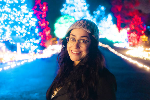 istock Woman at a Christmas Light Park Trail - Close Up 1456916728
