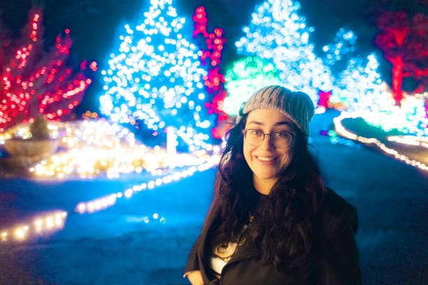 istock Woman at a Christmas Light Park Trail - Wide Angle 1456916823