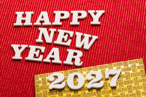Happy new year 2027 - White wooden letters on red background