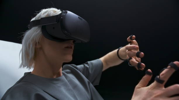 istock Cyberpunk man enjoying VR interactive chair closeup. Player touching metaverse 1456920638