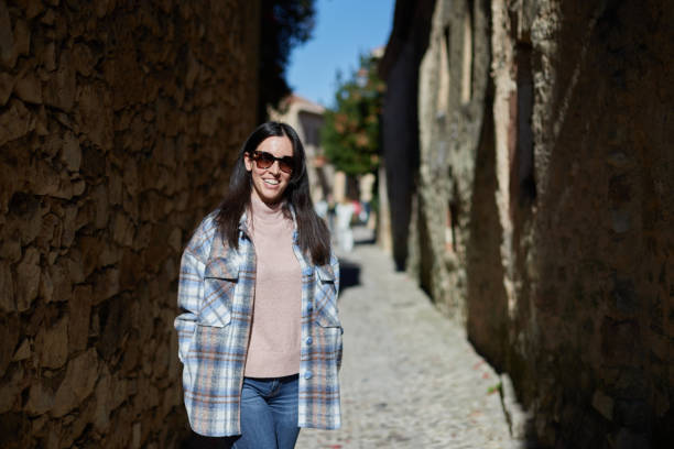 istock Smiling girl strolling through town 1456923106