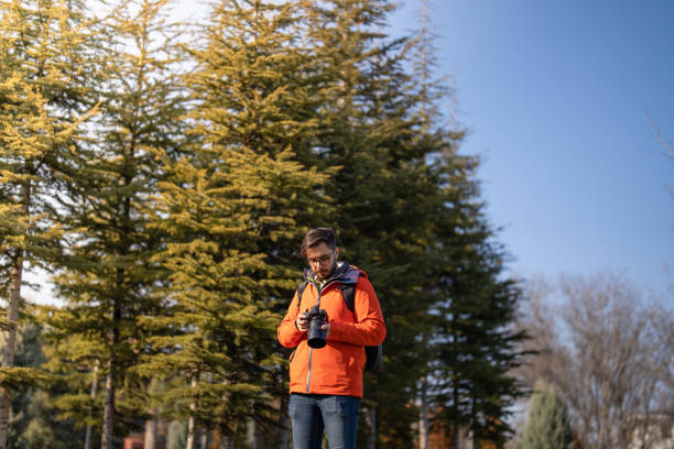 istock Photographer taking photo in nature 1456923345