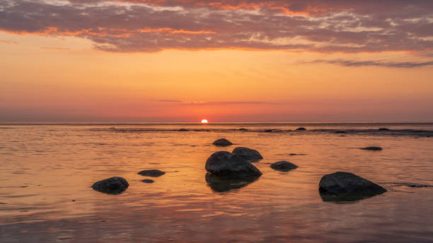 istock Calm orange sunset on the evening sea 1456923418