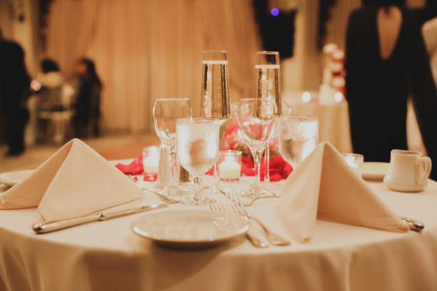 istock wedding venue tables flowers alcohol reception celebration candles 1456928709