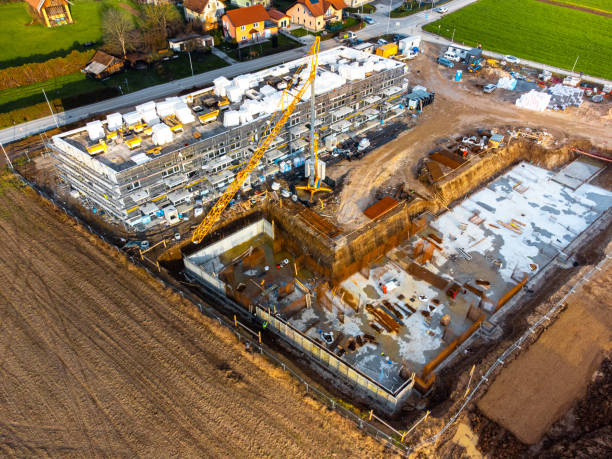 istock Two new apartment buildings under construction aerial view 1456928978