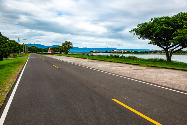 istock Road and running track beside Kwan Phayao lake 1456929023