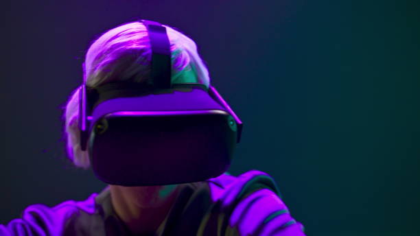 istock VR glasses person dancing metaverse closeup. Millennial man relaxing 3d headset 1456933133