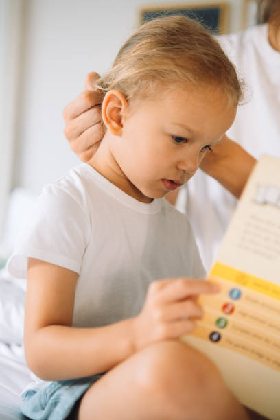 istock Mother and a daughter playing together 1456933183