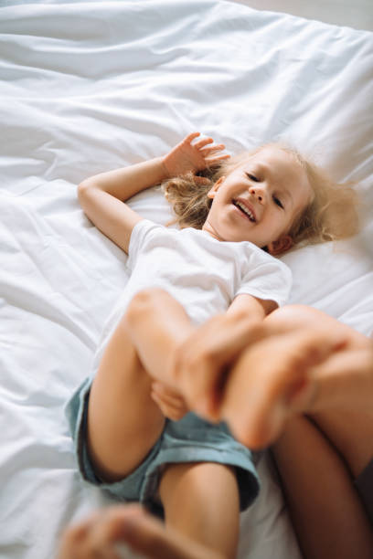 istock Mother and a daughter playing together 1456933186