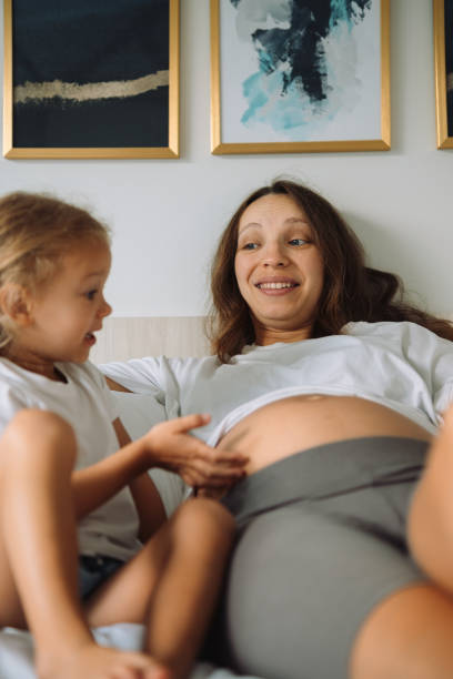 istock Mother and a daughter playing together 1456933748