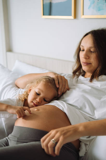 istock Mother and a daughter playing together 1456933840