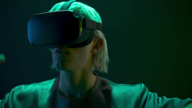 istock Vr goggles gamer enjoying innovation data cyberspace. Man in virtual world 1456934529