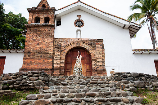 Beautiful young woman at the historical San Antonio Church located in the city of Cali in Colombia