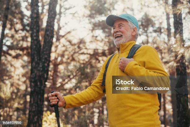 Head Shot Portrait Close Up Of Middle Age Caucasian Man Walking And Enjoying Nature In The Middle Of Trees In Forest Old Mature Male Wearing Glasses Trekking And Discovering Stock Photo - Download Image Now