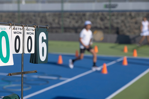 Tennis scoreboard on display at children's training session