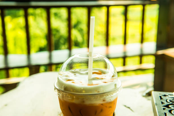 istock Iced Milk Tea in Plastic Glass with Natural View 1456944399