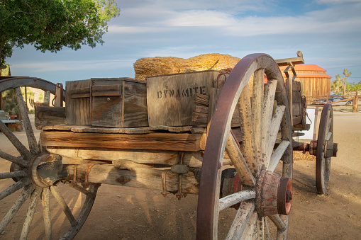 An old wooden wagon with dynamite box.