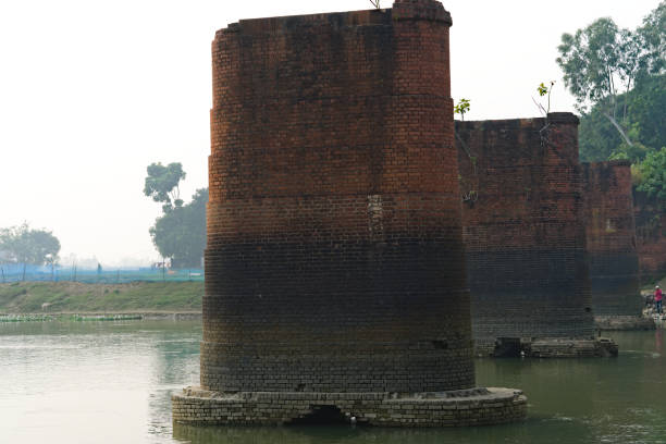 istock 17.12.2022. Historic pillars made of bricks built over a river for bridge support. India 1456950713