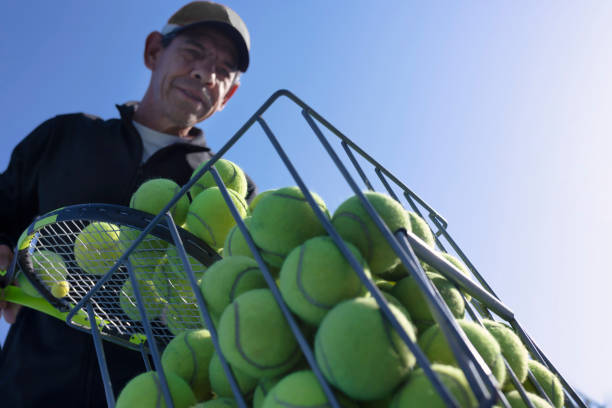 Close-up of tennis ball in green tennis field.