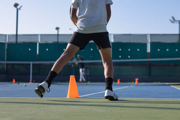 istock Person playing tennis 1456951103