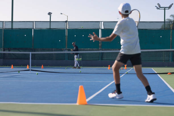 istock Pov as a child watching his partner playing on the court 1456951637
