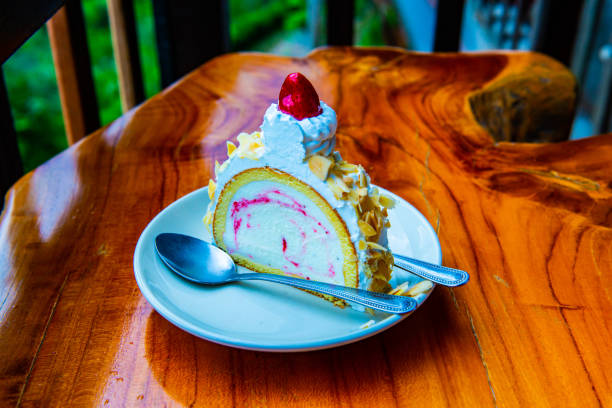 Almond ice cream cake on white plate, Thailand.