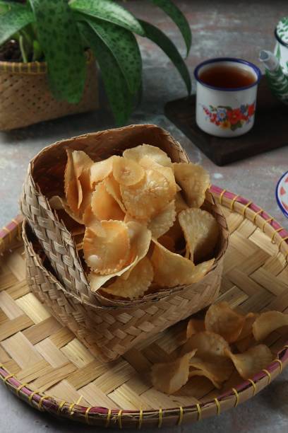 istock cassava chips in a woven bamboo container served with a cup of tea 1456953062