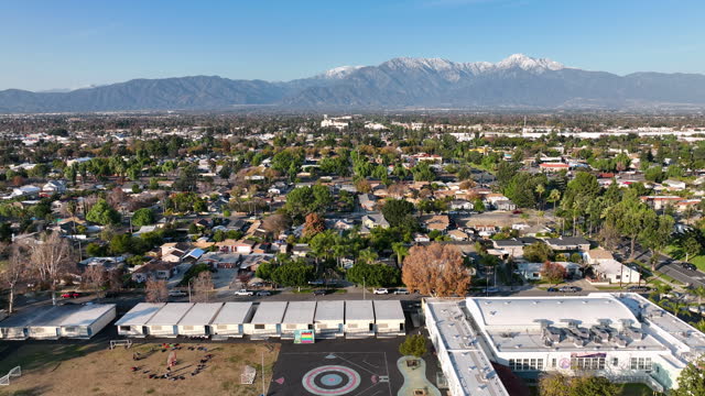 Aerial view of Ontario city in California with mountains in the background