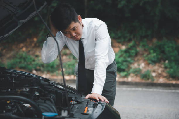 istock Asian businessman car broken breakdown 1456958651