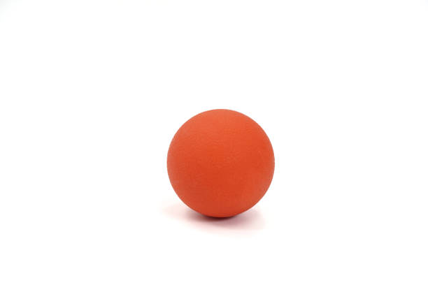 istock Picture shows a orange ball practicing muscle inflammation and physiotherapy exercises on a white background, isolated. 1456961073