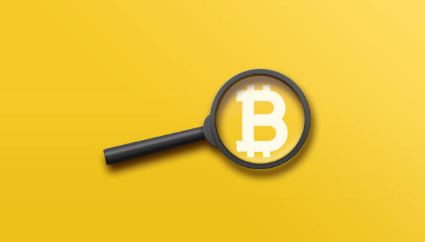istock Bitcoin (BTC) cryptocurrency search concept with magnifying glass on a yellow background. 3D illustration. 1456963188