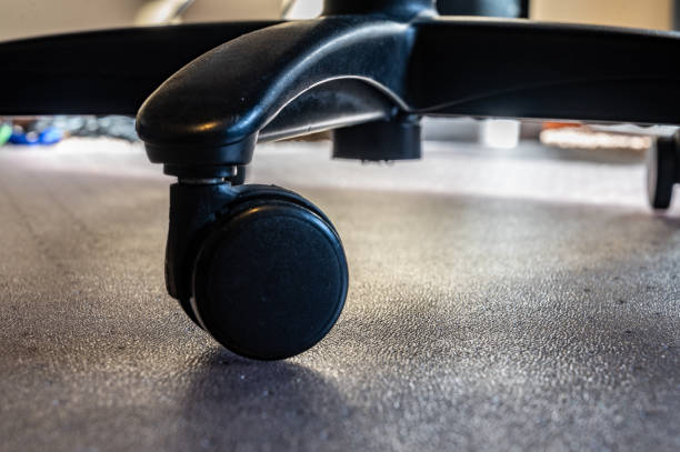 Use of a protective mat over carpet to reduce wheel indents over time
