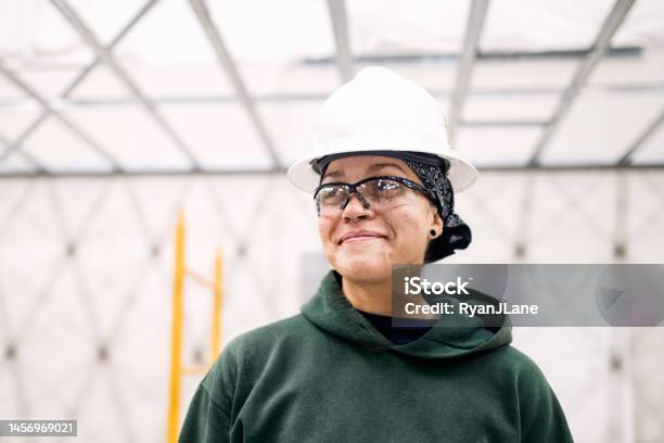 Woman Construction Worker On Job Site Stock Photo - Download Image Now - Labor Union, Construction Site, Education Training Class