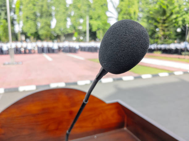 istock Shallow depth of field.  A Microphone stands before the event 1456970586
