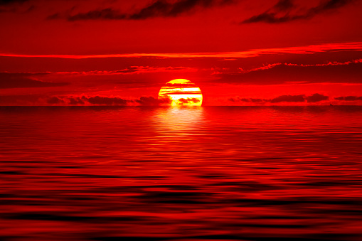 Stunning vibrant red sunset Waimea Bay