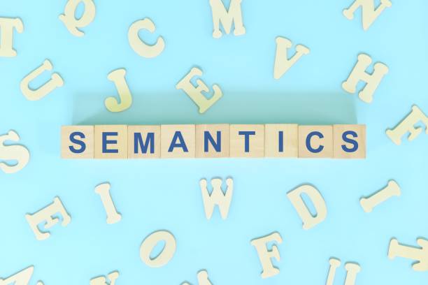 istock Study semantics in linguistics concept. Wooden blocks word typography flat lay in blue background. 1456974531