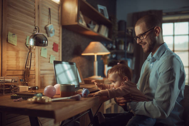 istock father working from home while babysitting his baby girl 1456983308