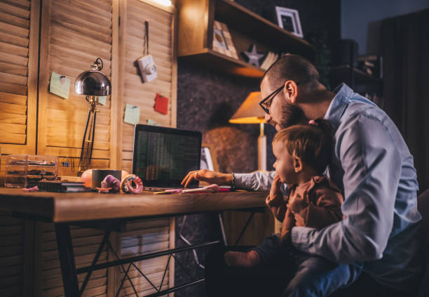 istock father working from home while babysitting his baby girl 1456983312