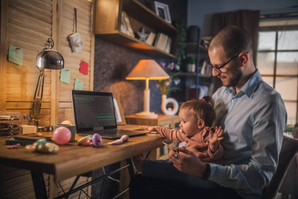 istock father working from home while babysitting his baby girl 1456983378