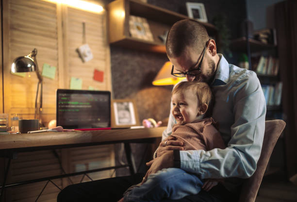 istock father working from home while babysitting his baby girl 1456983411